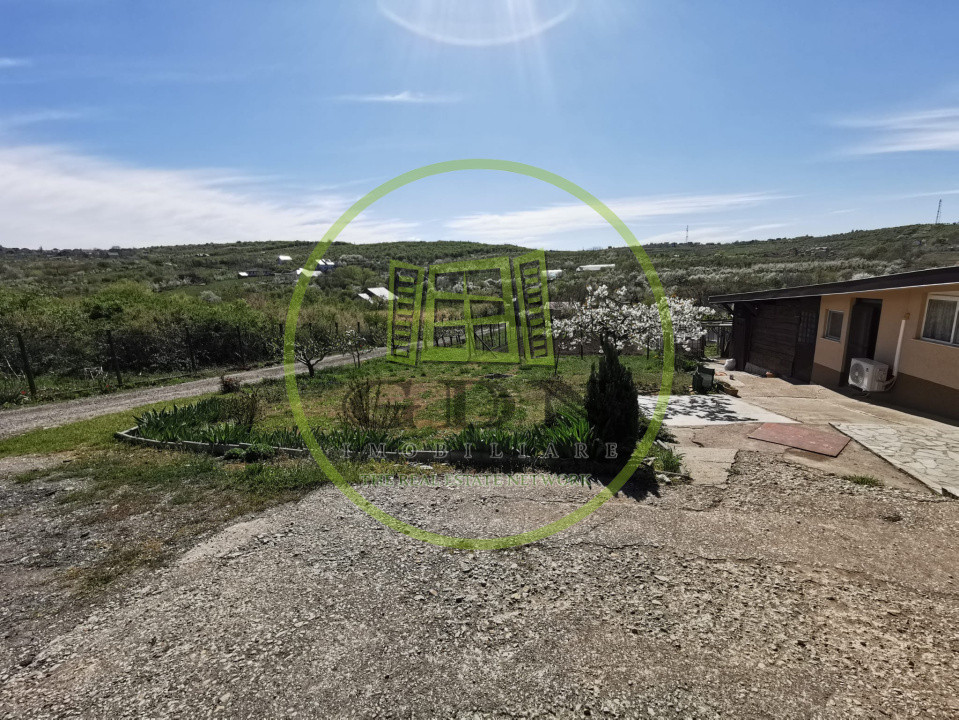 Teren intravilan si extravilan cu anexa gospodareasca amenajata, cu utilitati