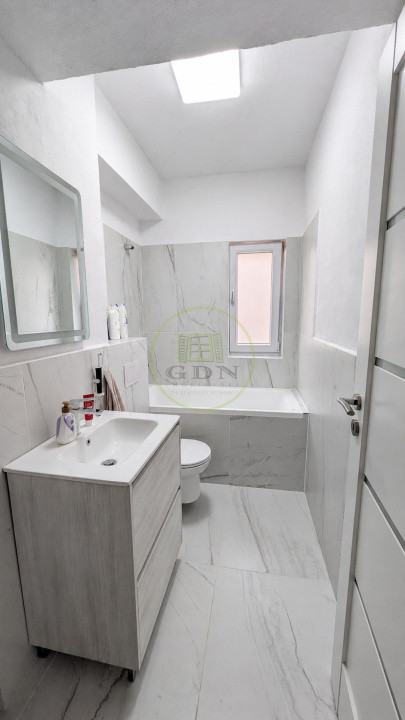 Apartament modern cu design impecabil, 3 camere, 2 băi și parcare